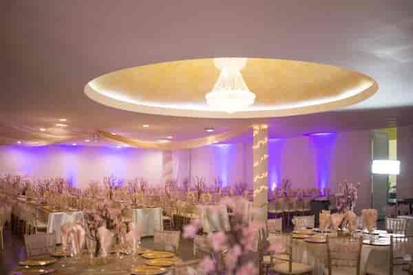 Elegant event space at Encanto with floral centerpieces, perfect for weddings and upscale gatherings.