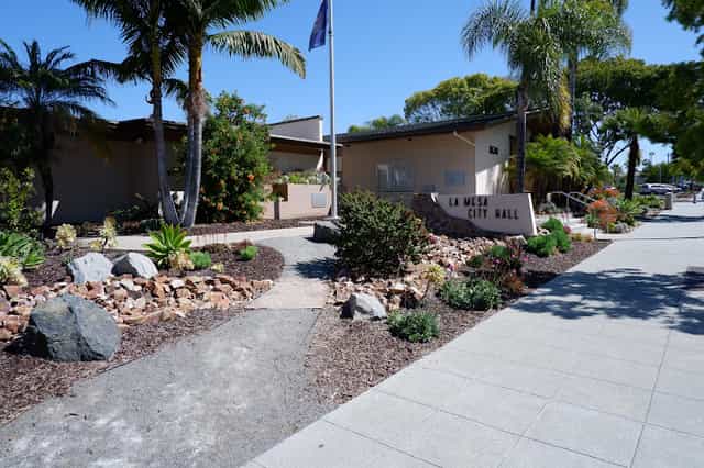La Mesa Community Garden at City Hall with palm trees, perfect for community events.