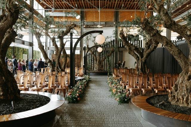 Dance floor with olive trees in Venue 808, perfect for weddings and gatherings.