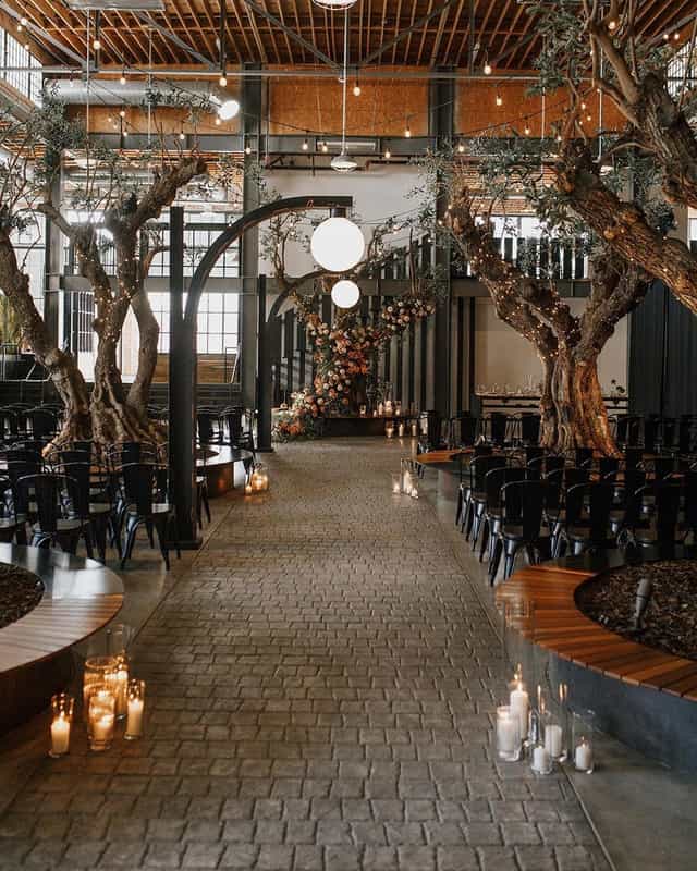Elegant dance floor with wooden trees, perfect for weddings and upscale events.