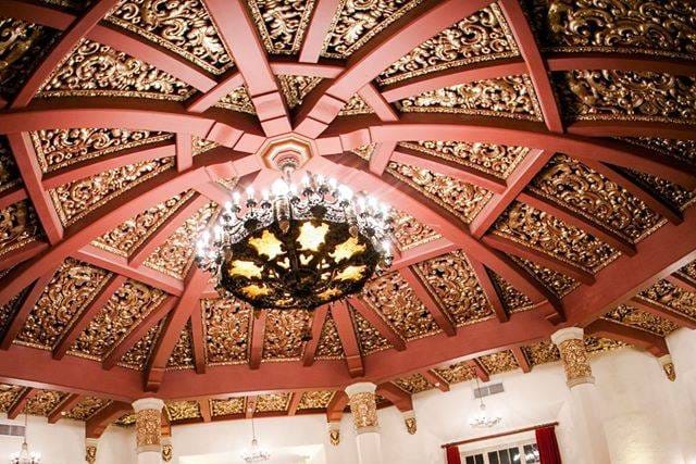 Ornate ceiling and chandelier in The Don Room, ideal for weddings and corporate events.