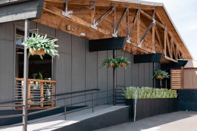 Modern Main Hall at JULEP Venue with wooden beams, perfect for events and gatherings.