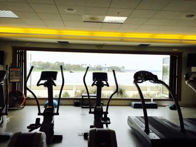Gymnasium at Coronado Community Center with modern equipment for wellness events and retreats.
