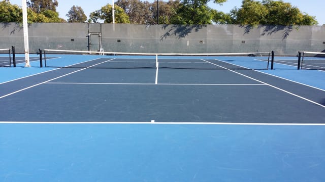 Tennis court at Linda Vista Recreation Center for outdoor events and team-building activities.