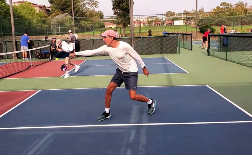 Tennis courts at Linda Vista Recreation Center during a lively event, promoting networking.