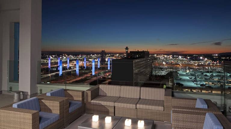 Rooftop restaurant at H Hotel LA with skyline views, perfect for evening events.