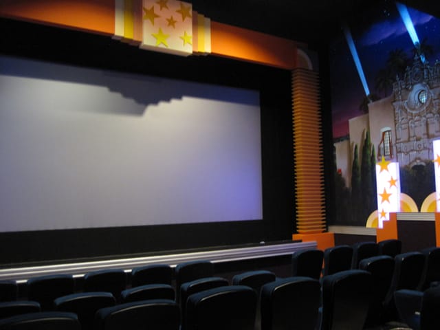 Main Screening Room at Village Theater with large screen, ideal for corporate events and film screenings.