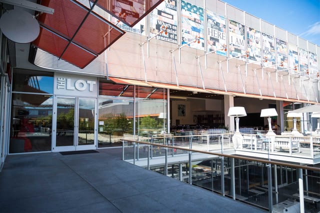 Modern event space at THE LOT with natural light, ideal for corporate meetings and social gatherings.