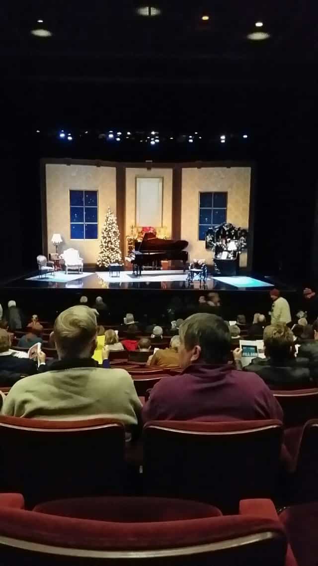Elegant stage with grand piano in Mandeville Auditorium for festive performances.