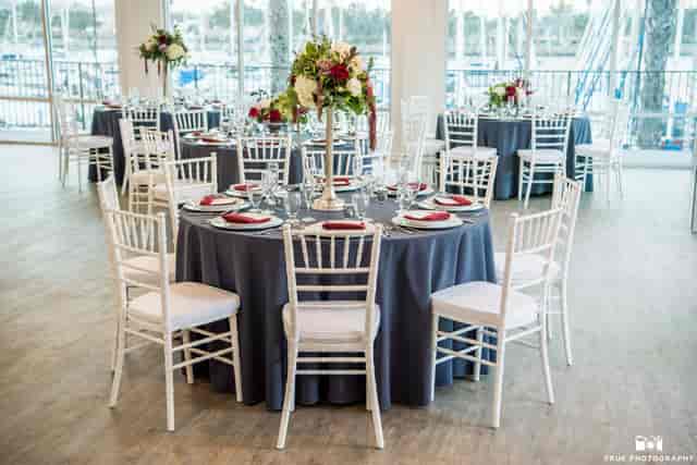 Elegant indoor reception space with navy tables, ideal for weddings and corporate events.