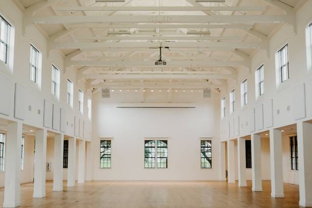 Spacious outdoor patio venue with high ceilings for meetings and events.