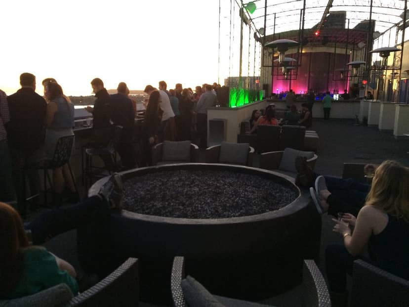 "Altitude Sky Lounge rooftop with fire pit, ideal for networking and social events."
