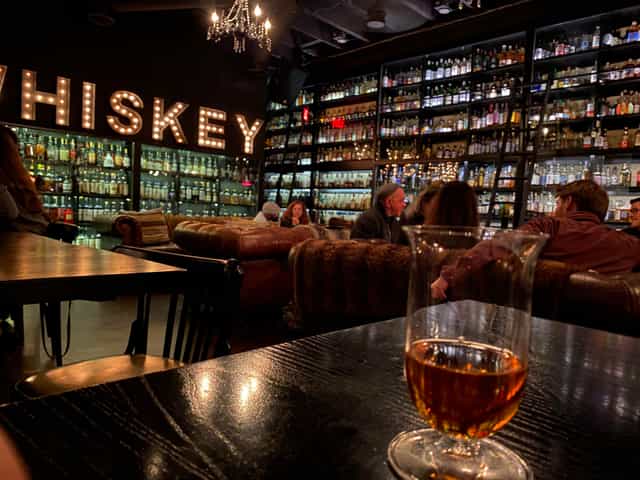 Cozy Whiskey Club venue with stylish decor, ideal for tastings and networking events.
