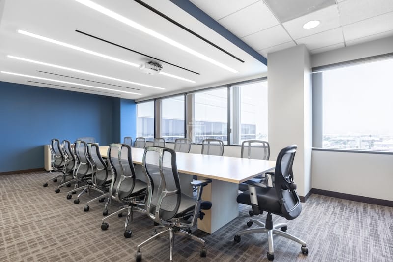 Modern conference room with large table and projector for meetings in El Segundo.