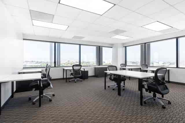 Modern meeting room with natural light at Regus El Segundo for productive sessions.