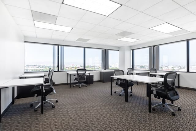 Modern meeting room with natural light at Regus El Segundo for productive sessions.
