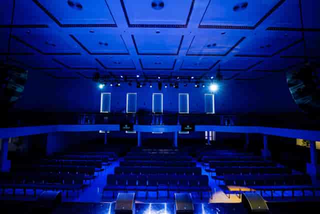 Modern auditorium with tiered seating in Ovation Square for events and presentations.