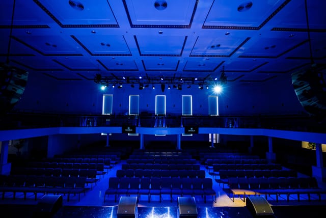 Modern auditorium with tiered seating in Ovation Square for events and presentations.