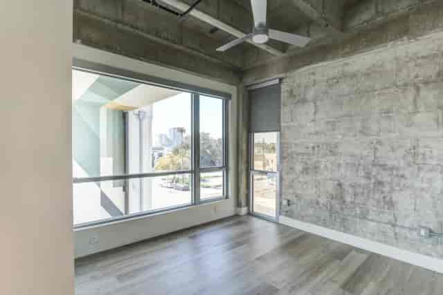 Modern Sun Room at Bankers Hill Club, featuring large windows for meetings and events.