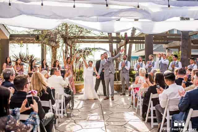 "Elegant outdoor wedding ceremony at Marina Village Conference Center, Ranch Events."
