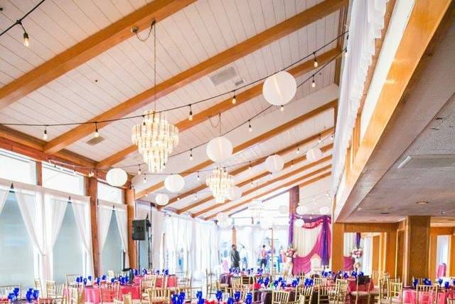 Elegant chapel event space with chandeliers, ideal for weddings and corporate gatherings.