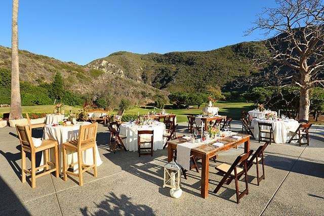 Elegant outdoor wedding venue at The Ranch at Laguna Beach with scenic hills.