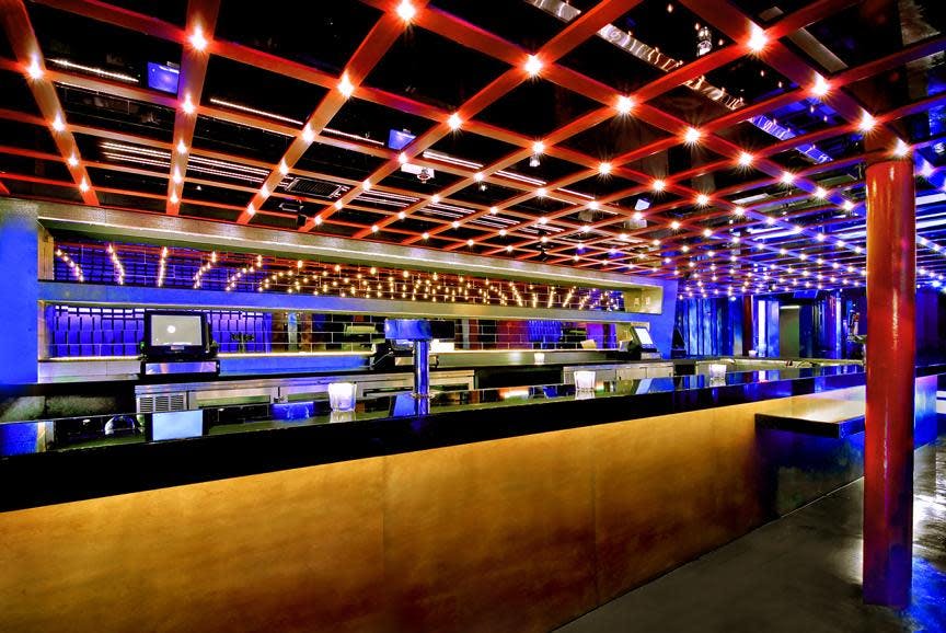 Modern event space with sleek bar, ideal for cocktail receptions and networking.