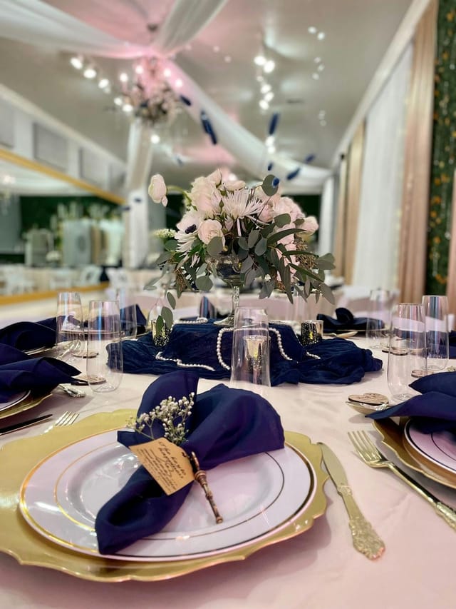 Elegant table setting with white flowers for weddings and corporate events.