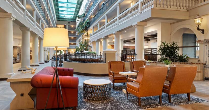 Spacious hotel atrium with natural light, ideal for networking events at Embassy Suites.