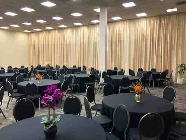 Elegant event space with round tables, ideal for conferences and banquets.