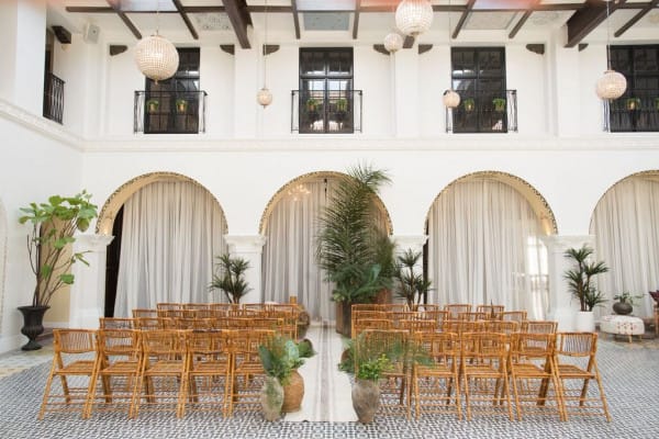 Elegant banquet hall with wooden chairs, ideal for intimate gatherings and ceremonies.