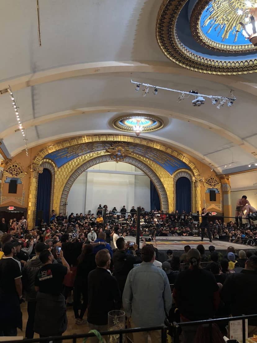 Ukrainian Culture Center wrestling event with ornate architecture and engaged audience.