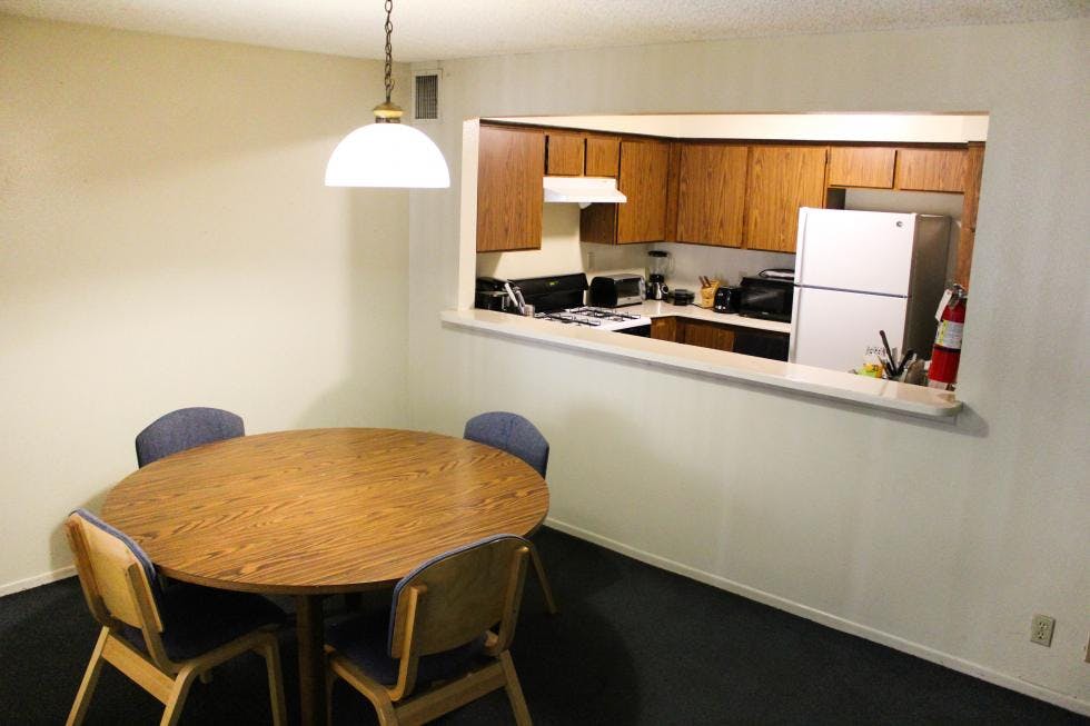 Meeting room with round table and chairs at Cal State LA for group discussions.