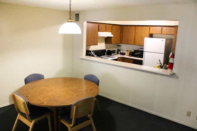 Meeting room with round table and chairs at Cal State LA for group discussions.