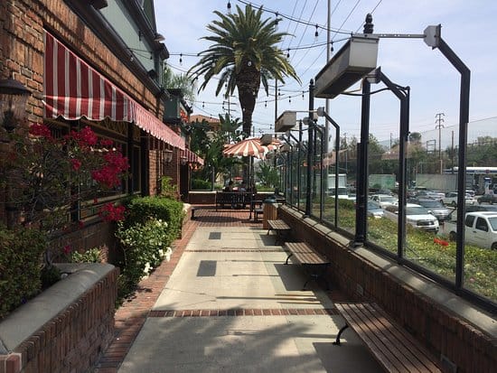Charming outdoor patio at Lucille's Smokehouse BBQ, ideal for casual events and gatherings.