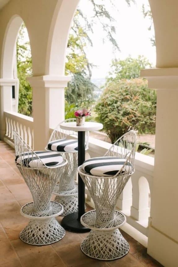 Stylish outdoor seating at Wrensmoor Castle for networking and casual meetings.