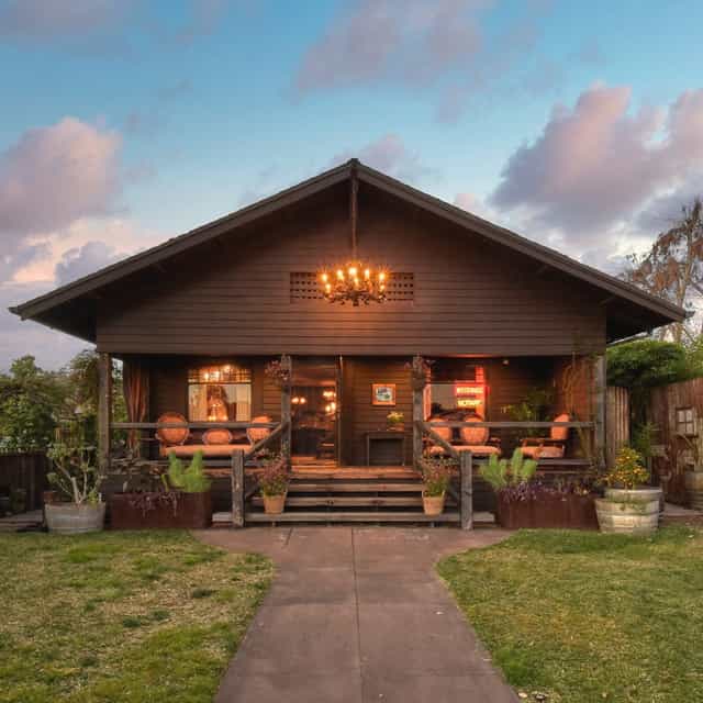 Green Room Lounge in Old Brown House, rustic venue for intimate events and gatherings.