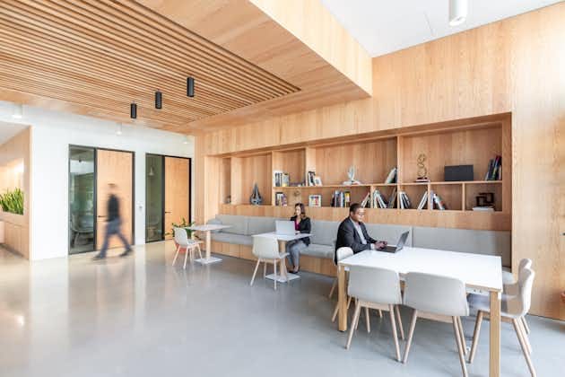 Modern open-concept meeting space with warm wood accents for collaborative events.