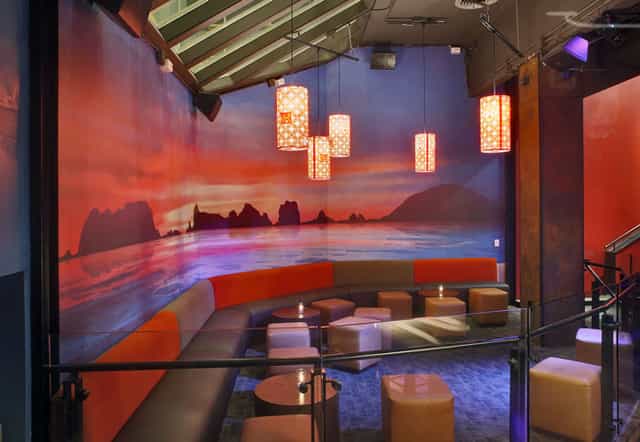 Stylish lounge with sunset mural, perfect for networking events and cocktail receptions.