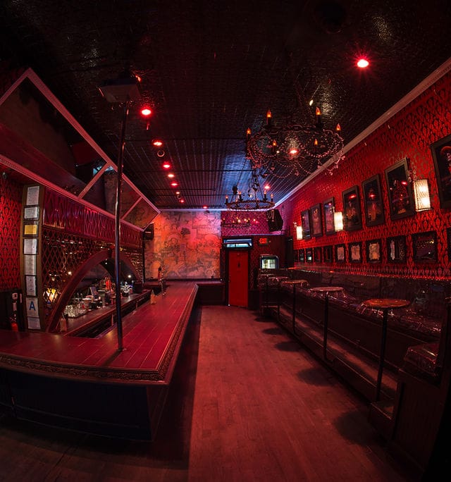 "Eastside Luv Wine Bar with elegant chandelier, perfect for cocktail receptions and events."