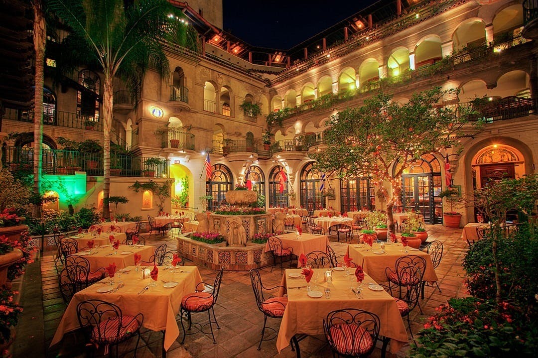 Mission Inn Hotel courtyard, elegantly lit for intimate dinners and receptions.