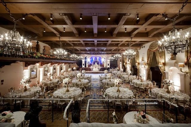 Grand Parisian Ballroom with floral centerpieces, perfect for weddings and galas.
