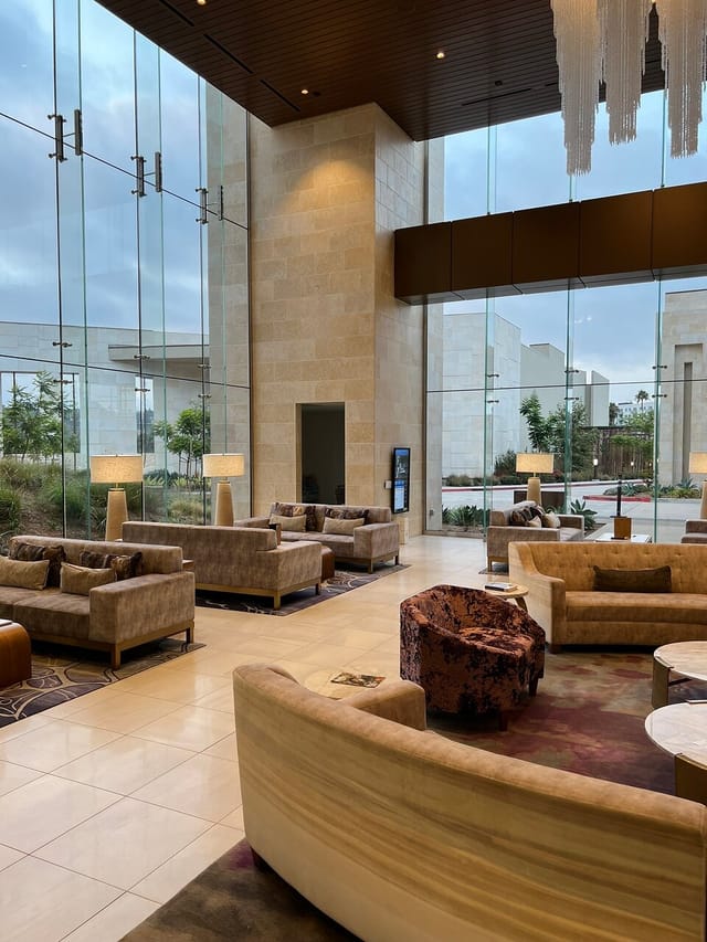 Spacious modern lobby at Legacy Resort Hotel & Spa, ideal for networking events.