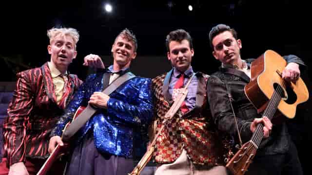 Lamb's Players Theatre band performance with vibrant costumes for unforgettable events.