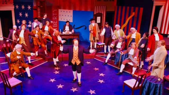Ballroom at Lamb's Players Theatre, vibrant historical performance for themed events.