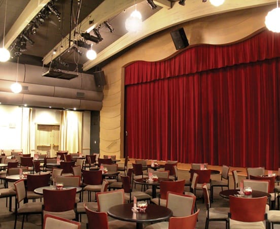 Coronado Playhouse event space with red curtains, ideal for corporate events and performances.
