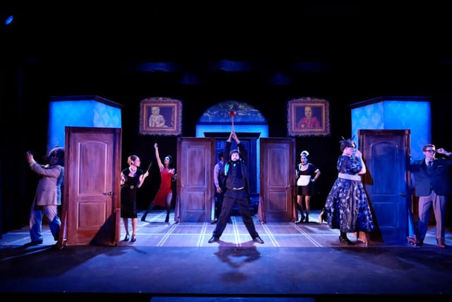 Dynamic theatrical performance at Coronado Playhouse with dramatic lighting and ambiance.