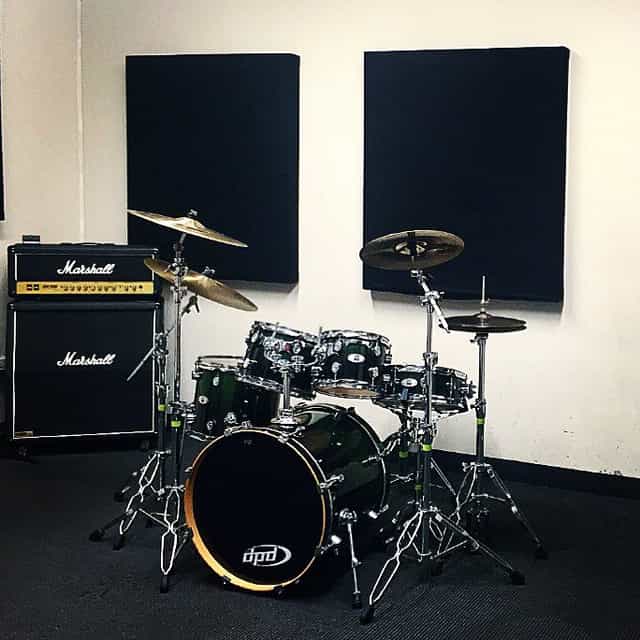 Studio 12 rehearsal space with drum kit, ideal for live music events and band rehearsals.