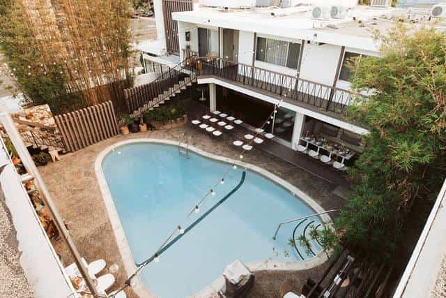 Stylish outdoor wedding venue with heart-shaped pool at The Pearl Hotel.