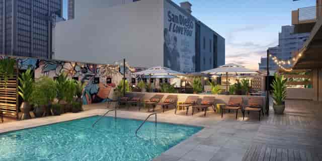 Stylish rooftop venue with pool at Kimpton Alma Hotel for events and gatherings.